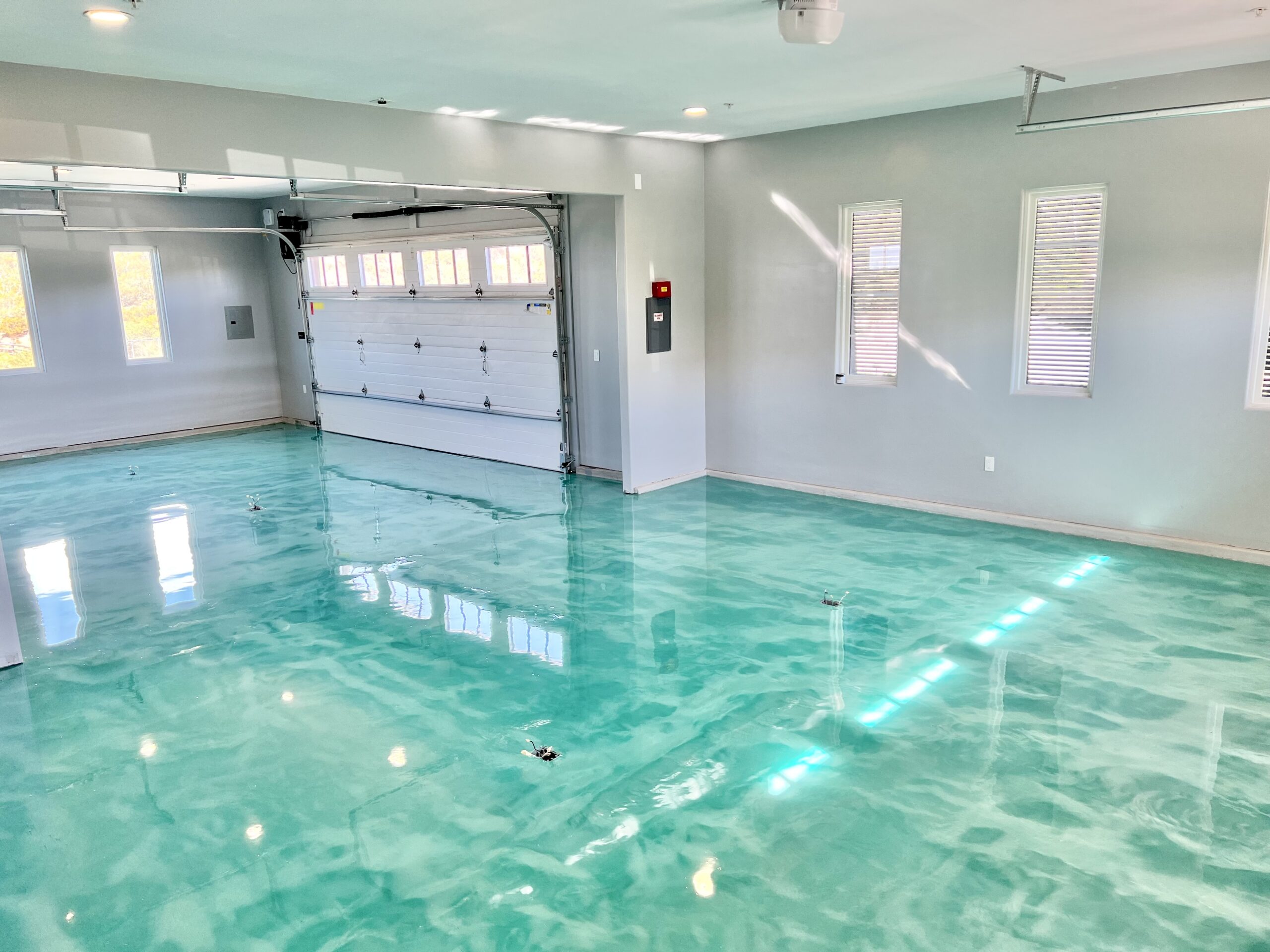 Teal metallic epoxy floor
