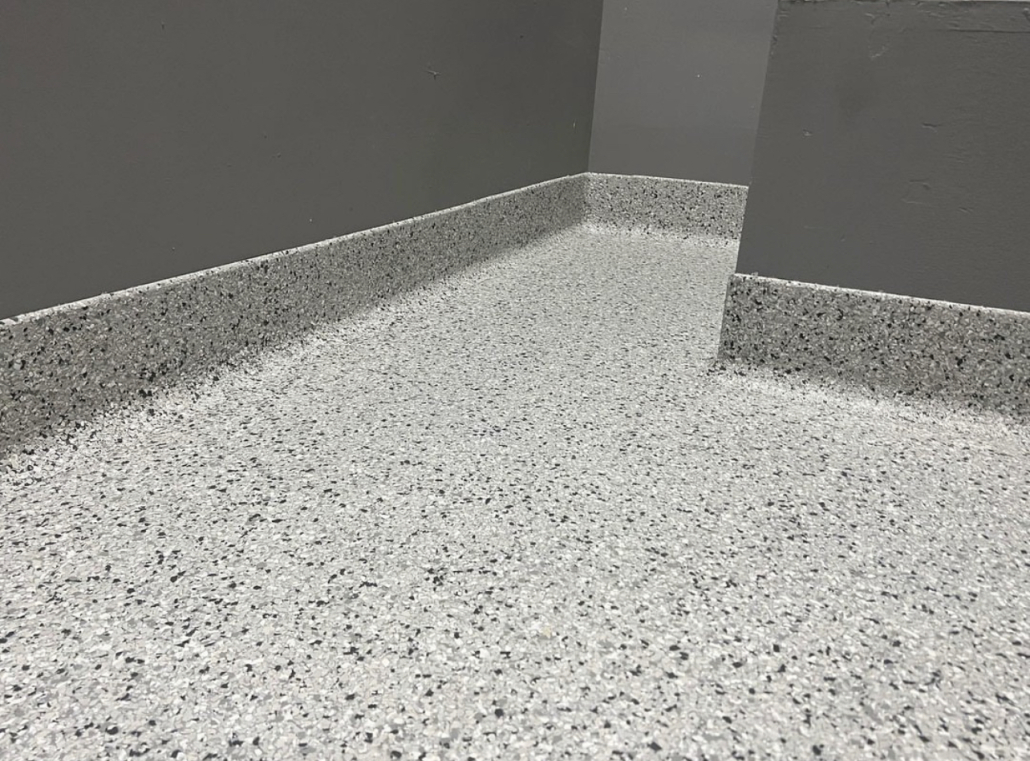 Flake epoxy floor with cove base