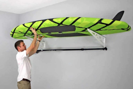 Stand up paddle board ceiling rack in a garage