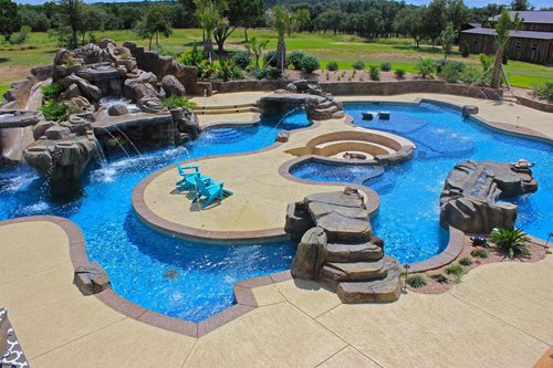 Pool deck coating around a backyard pool