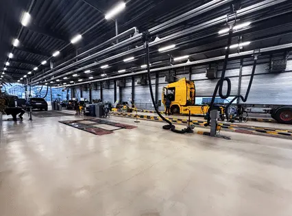 Auto service shop with a smooth coated concrete floor