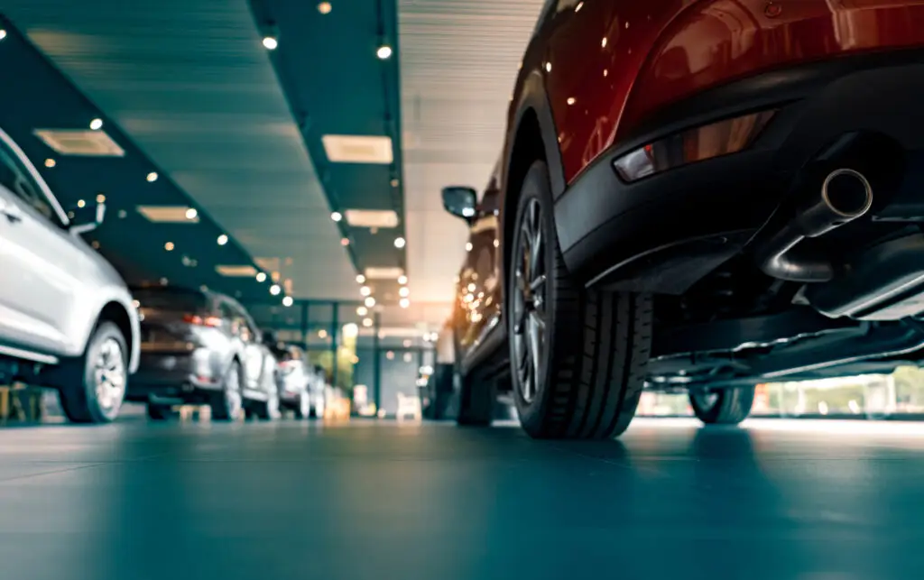 Cars parked on a glossy coated concrete floor